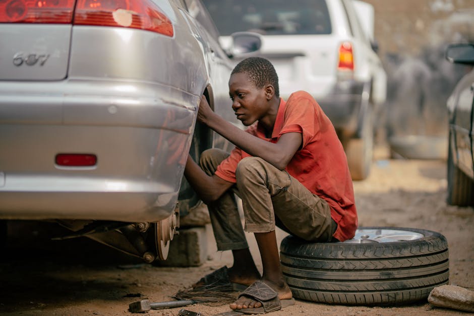 Mechanic expertly installing a car tire on a vehicle