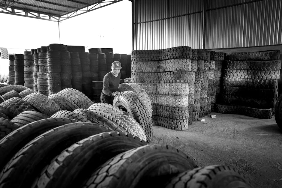 Stacked tires organized in a professional warehouse